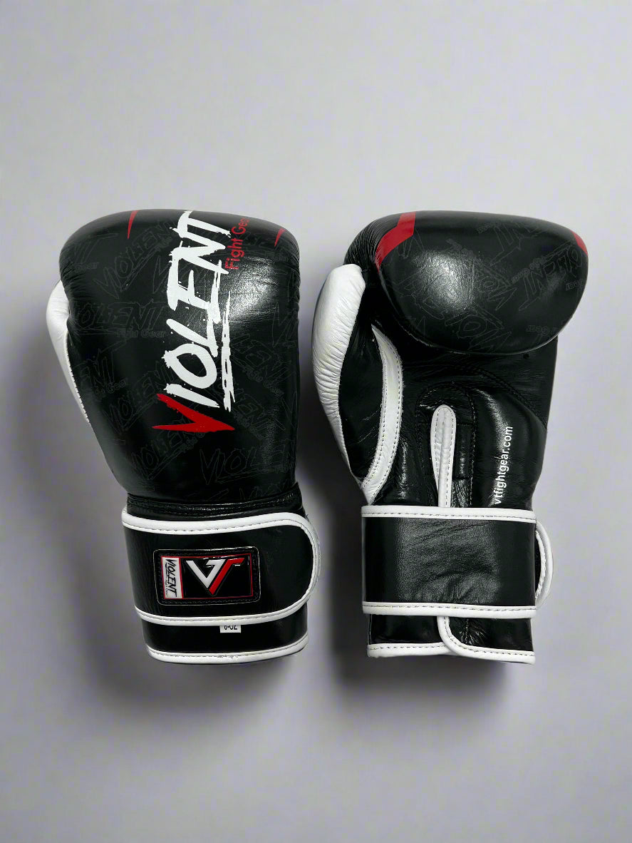 Pair of black boxing gloves with visible branding on a white background